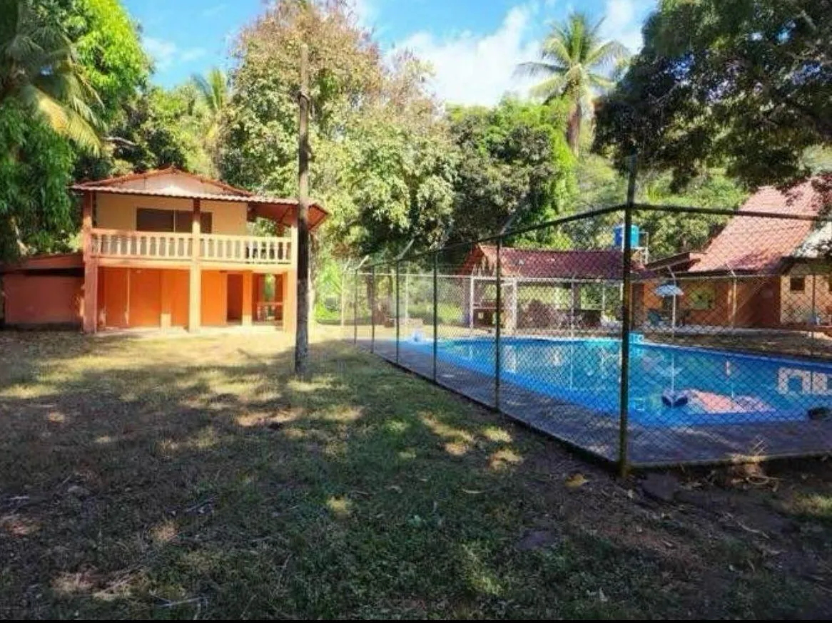 EXCLUSIVE OPPORTUNITY IN PLAYA AZUL: 7,658 m² LOT + 3 HOUSES & POOL INCLUDED! - image 6